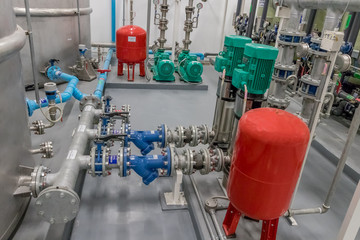 Typical installation of y-strainer with flex and butterfly vale with vertical water pump