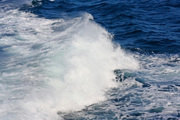 Small blue sea wave. Nature background. Beautiful natural composition. Wave as a background. 