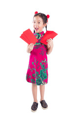 Full length of little chinese girl in red color traditional dress stand,holding red packet money and smiles isolated over white background