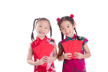 Little chinese girls in red color traditional dress,holding red packet money and smile isolated over white background