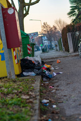 trash bins and garbage on the ground