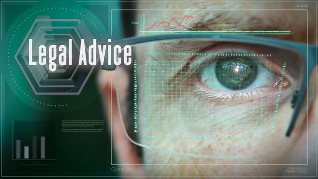 A close up of a businessman eye controlling a futuristic computer system with a Business Legal Advice concept.