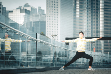 Fototapeta na wymiar Young asian woman doing excusice in the city