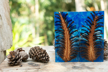 casting epoxy resin Stabilizing pine cone red blue abstract art blur background, Texture of a wooden blanks