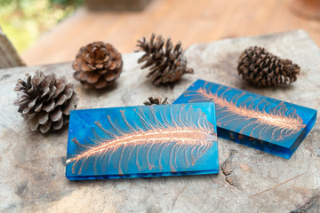 casting epoxy resin Stabilizing pine cone red blue abstract art blur background, Texture of a wooden blanks