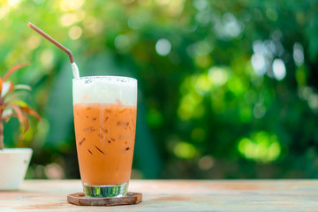 Black coffee or Americano on table with film vintage tone background.