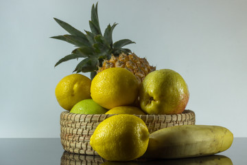 bowl of fresh ripe fruit on shiny surface 