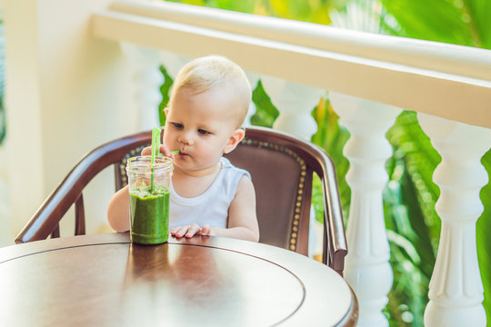 Child Boy Drinking Healthy Green Vegetable Smoothie - Healthy Eating, Vegan, Vegetarian, Organic Food And Drink Concept