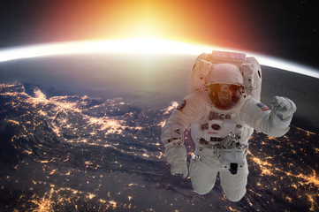 Obraz na płótnie Canvas Planet Earth and astronaut