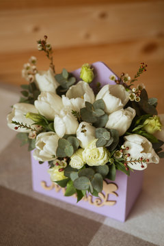 A bouquet and an arrangement of beautiful white tulips. A great gift for a holiday or birthday dear person mother, beloved