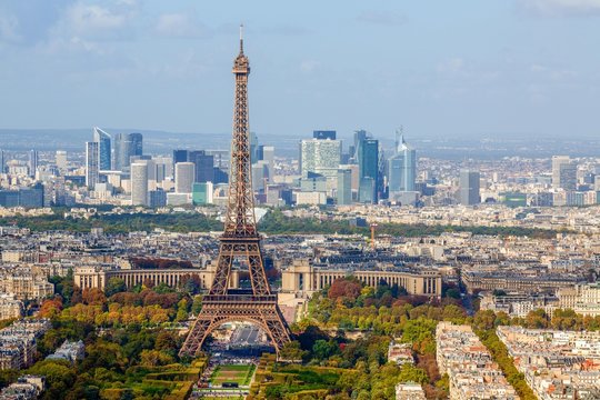 Eiffel tower in front of high-rise La Defense quarter, Paris, France, Europe