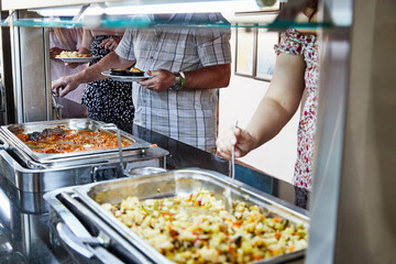Food on the shelves in the self service buffet with all inclusive in the hotel