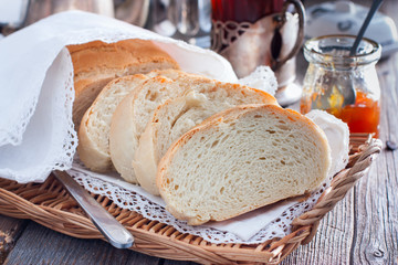 Homemade white bread in a rustic style, sliced, horizontal