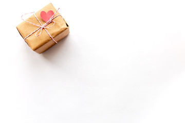 Wrapped vintage gift box with pink ribbon bow on white background