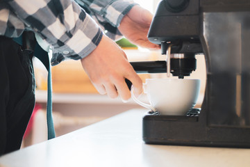 person use coffee machine to make fresh espresso  f