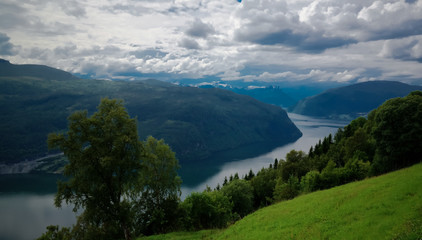 Naklejka na ściany i meble Landscape panoramic view to innvikfjorden, innvik and utvik village, Norway