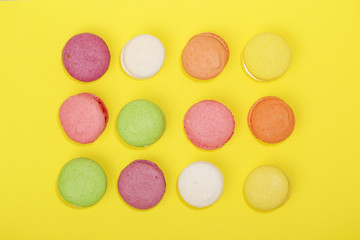 Bright background with rows of macaroons