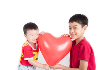 Boy  sibling with balloon  heart shape of love