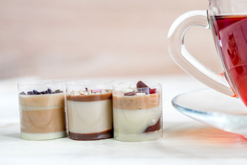 chocolatw praline canidies and cup of black tea. Close up.