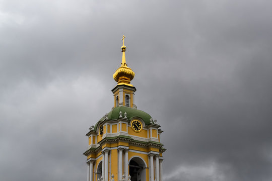 Bell Tower of Novospassky Monastery in Moscow against a dark cloudy sky. Russia