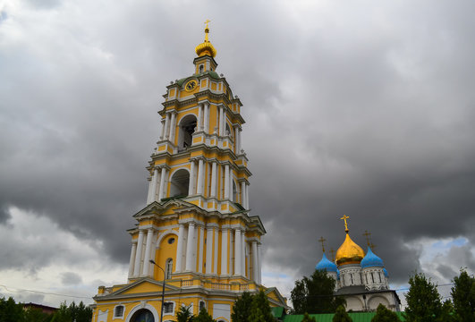 Bell Tower of Novospassky Monastery in Moscow against a dark cloudy sky. Russia
