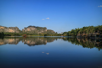 Fototapeta na wymiar reflection of Eravan mountain in the river against clear sky