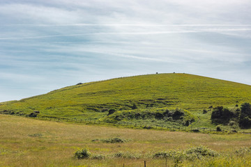 Fototapeta premium Green Grass Hill Countryside View