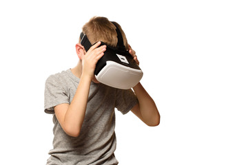 Boy experiencing virtual reality head bowed. Isolate on white background. Technology concept