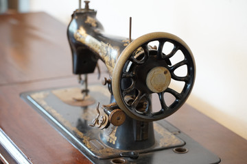 Old nostalgic sewing machine of the room