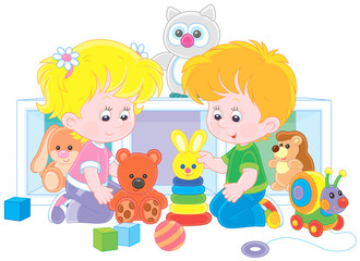 Small children playing with colorful toys in a nursery, vector illustration in a cartoon style