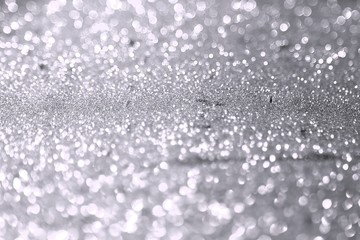 painted brassy sand made of glitters - festal concept with bokeh texture - nice abstract photo background