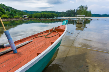 Wooden fishery boat on sea beach