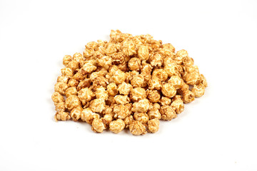 Pile of caramel popcorn on white background.