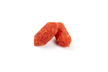 Small smoked sausages isolated on a white background.