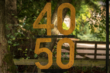 Sign: Speed limit 40 50, seen at Levisham Station, North Yorkshire, England, UK