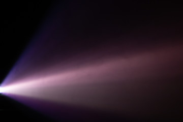 beautiful purple pantone color wide lens projector light beam . smoke abstract texture . screening for multimedia . black background .