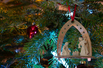 Christmas bauble on a Christmas tree and glowing lights
