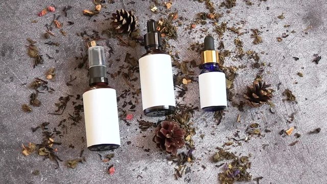 Flat lay of unknown cosmetics. Natural cosmetic. Concept of skin care and beauty. Smooth camera movement.