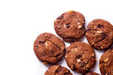 Overhead closeup image of chocolate cookies on white background with copy space