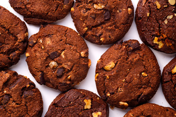 Overhead closeup image of chocolate cookies on white background