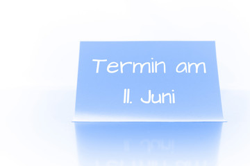 Termin am 11. Juni - blauer Zettel mit Notiz