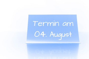 Termin am 4. August - blauer Zettel mit Notiz
