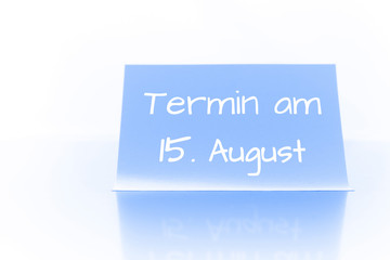 Termin am 15. August - blauer Zettel mit Notiz