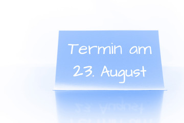 Termin am 23. August - blauer Zettel mit Notiz