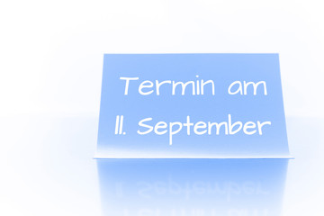 Termin am 11. September - blauer Zettel mit Notiz