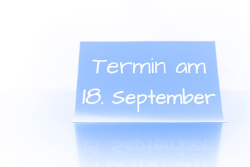 Termin am 18. September - blauer Zettel mit Notiz