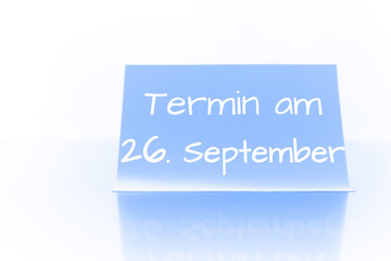 Termin am 26. September - blauer Zettel mit Notiz