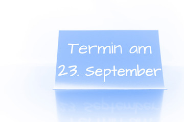 Termin am 23. September - blauer Zettel mit Notiz
