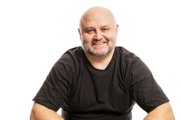 Bald middle aged man laughs, isolated on white background