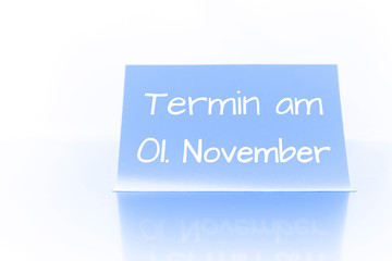 Termin am 1. November - blauer Zettel mit Notiz
